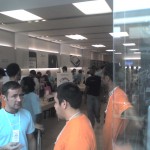 Customers inside a busy Apple Store