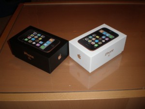 Two iPhone 3G boxes, one black and one white, on a table
