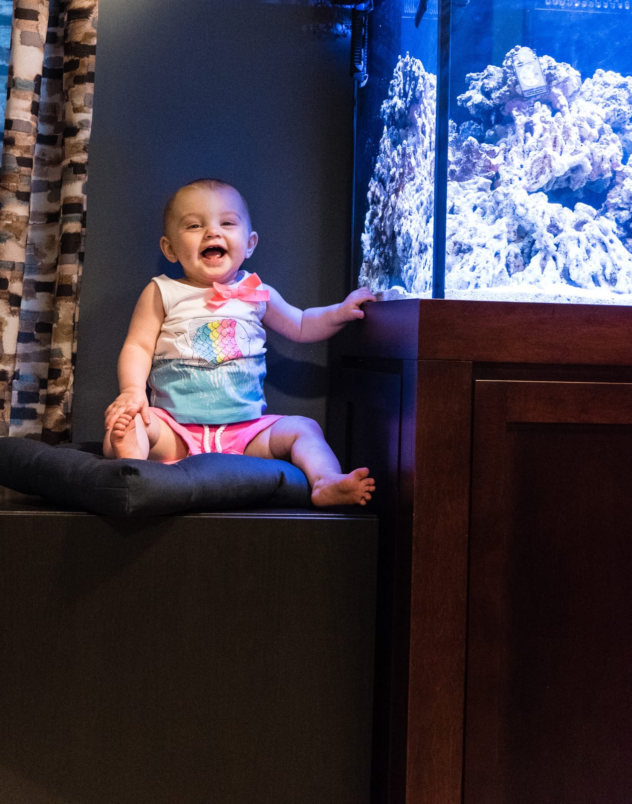 My daughter, thrilled with the tank